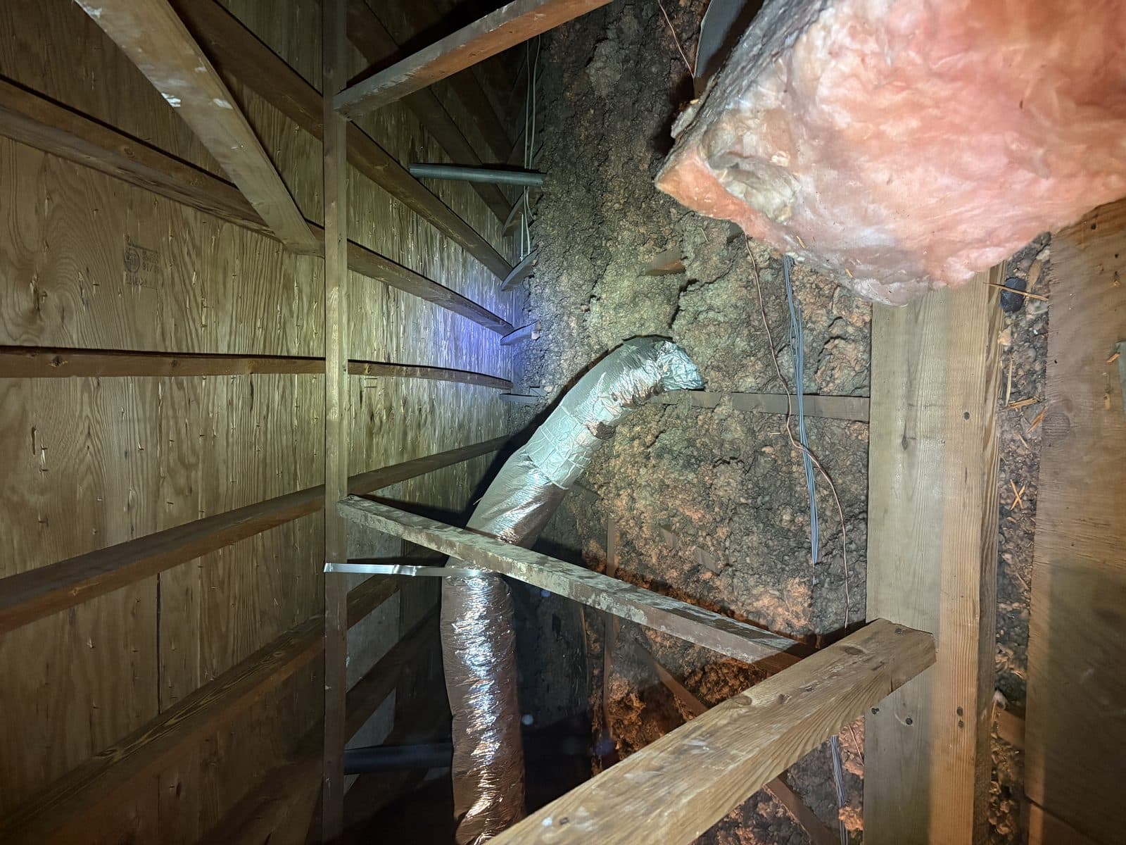 Old, dirty, contaminated attic insulation before removal